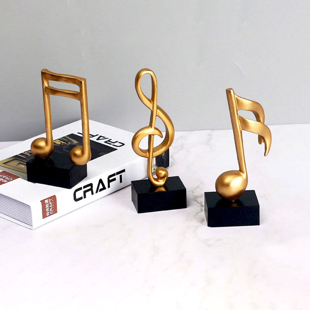Escultura Decorativa de Nota Musical em Resina Dourada